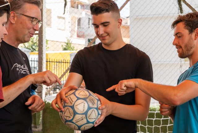 Brian holding a soccer ball