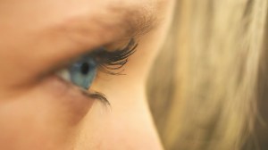 blue-colored eye looking out to the side