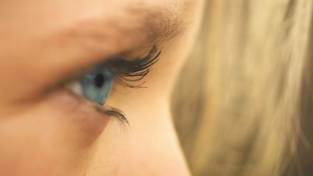 blue-colored eye looking out to the side