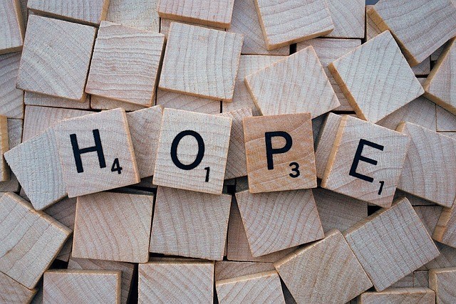 HOPE spelled out with scrabble tiles