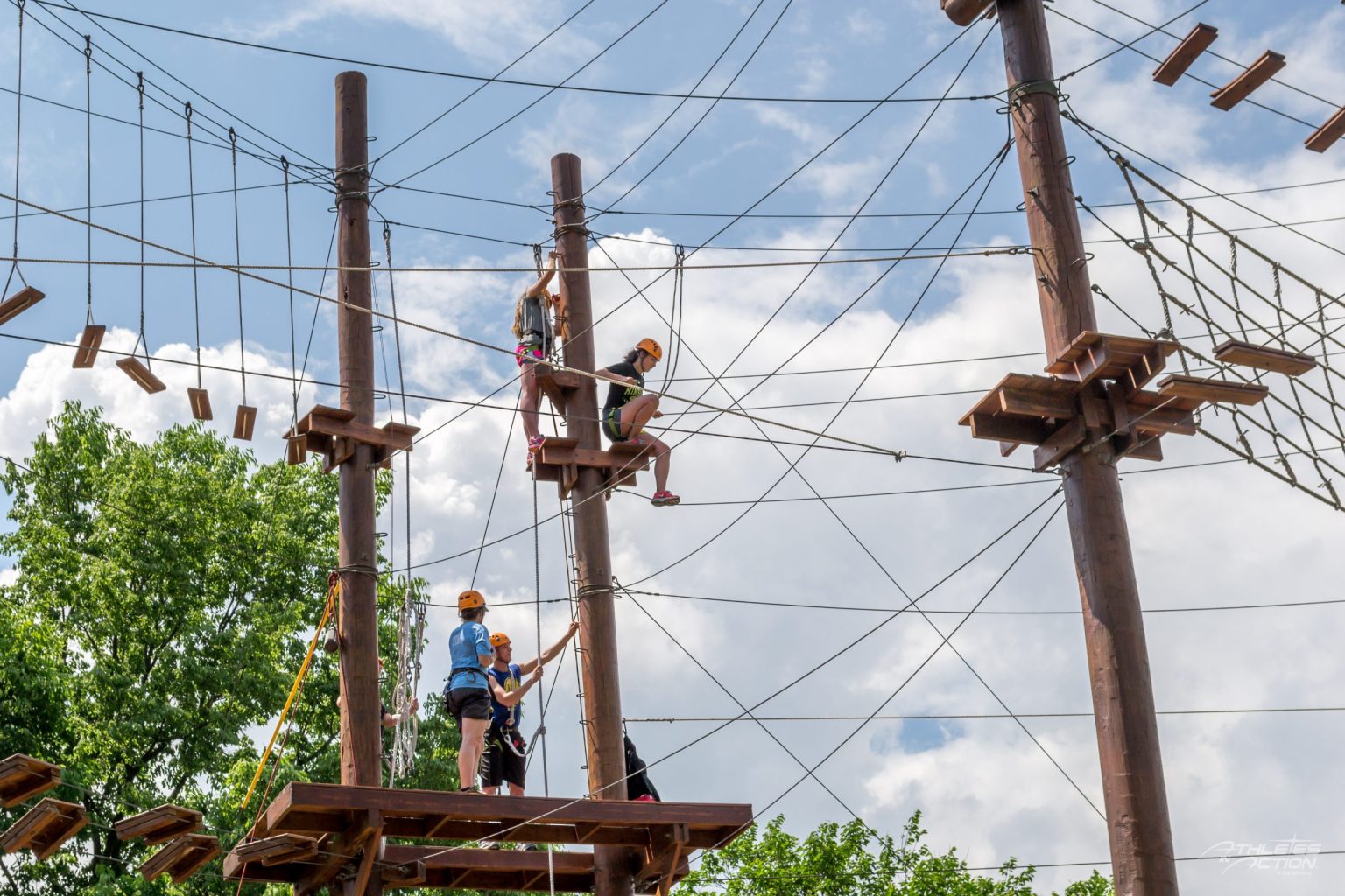 High ropes course elements among the trees at the Xenia campus