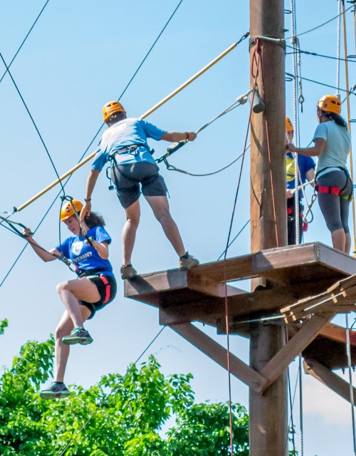 Athletes on the high ropes course at the AIA campus in Xenia, Ohio