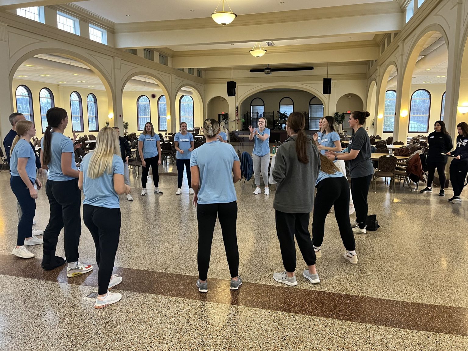 Athletes in a team activity in the Schindler Banquet Center