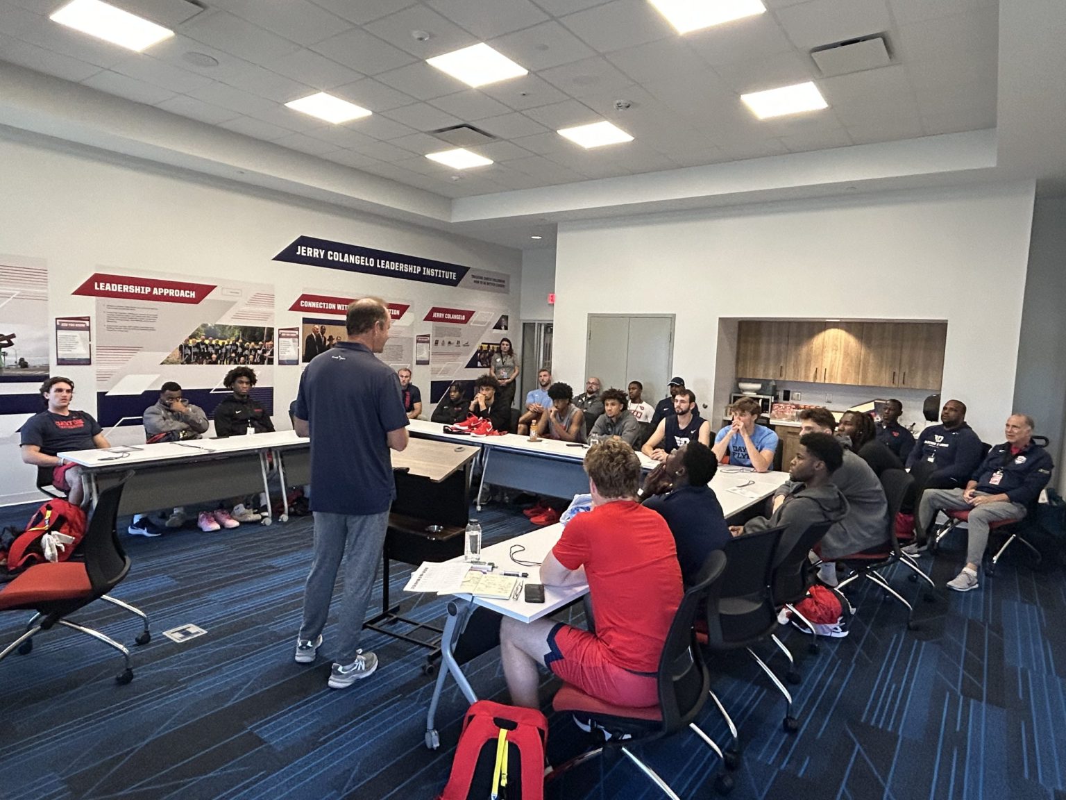 Team meeting at tables in a Fieldhouse conference room