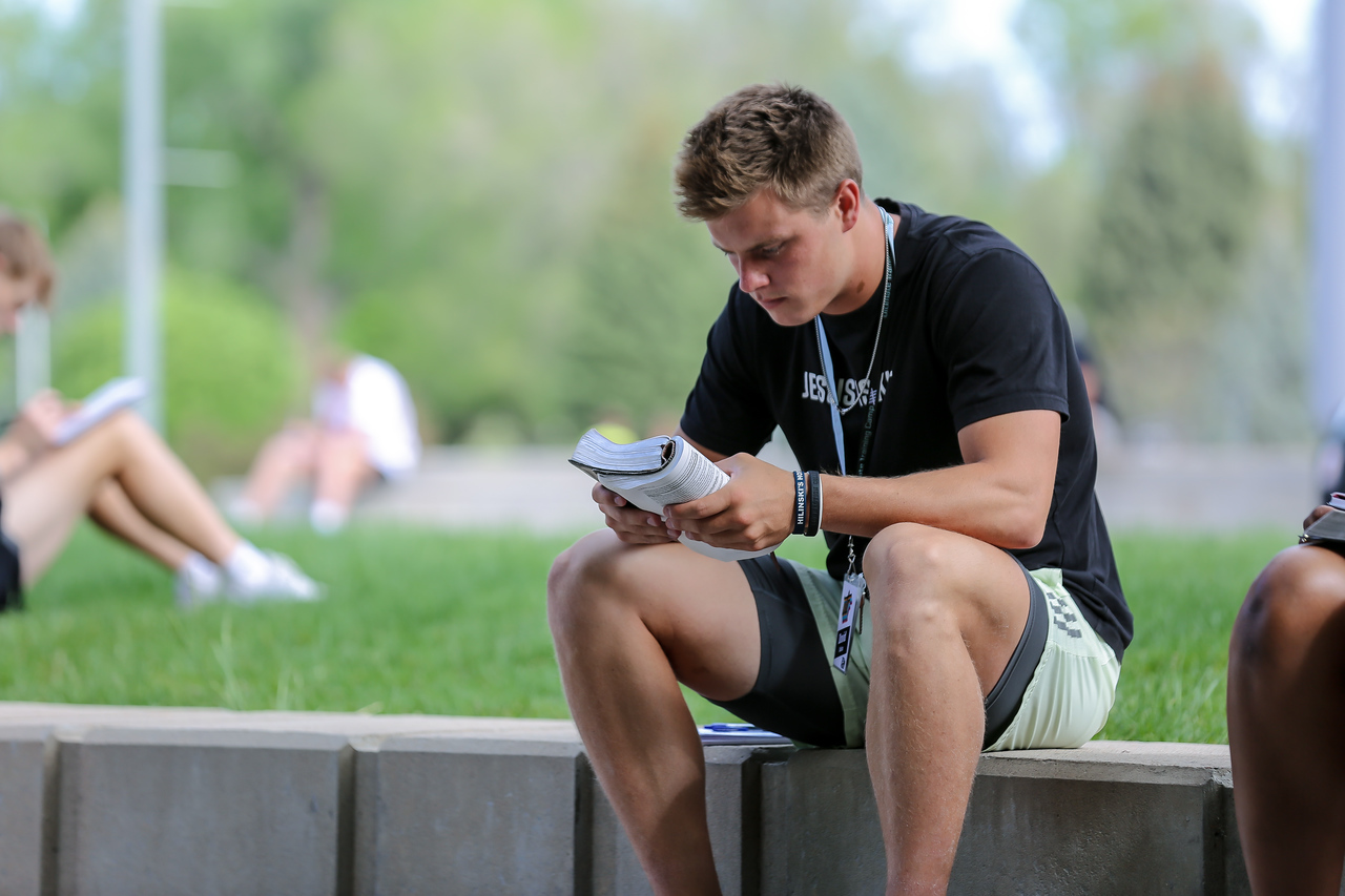 Athlete sitting alone on a ledge