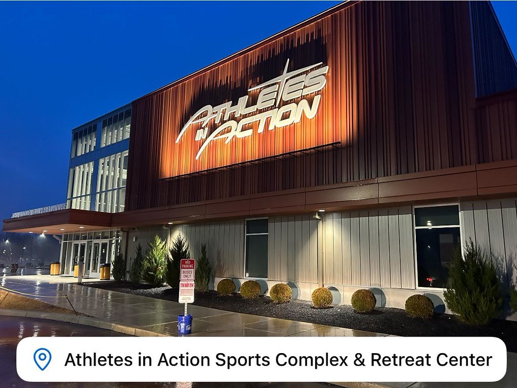 The John Wooden Family Fieldhouse lit up at night