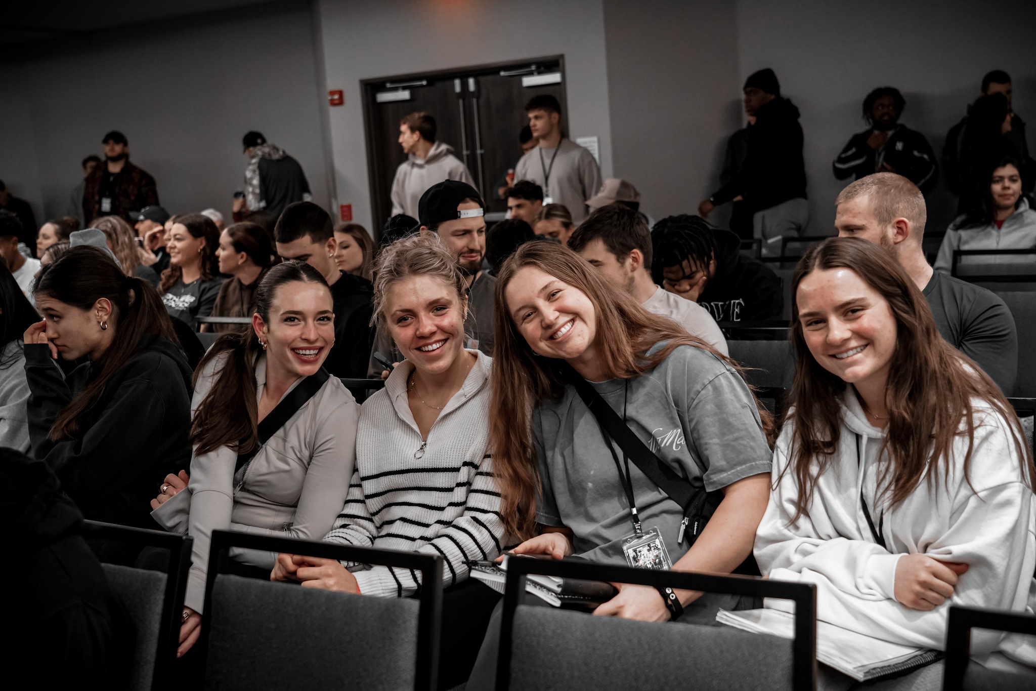 College athletes smiling together at an AIA winter retreat