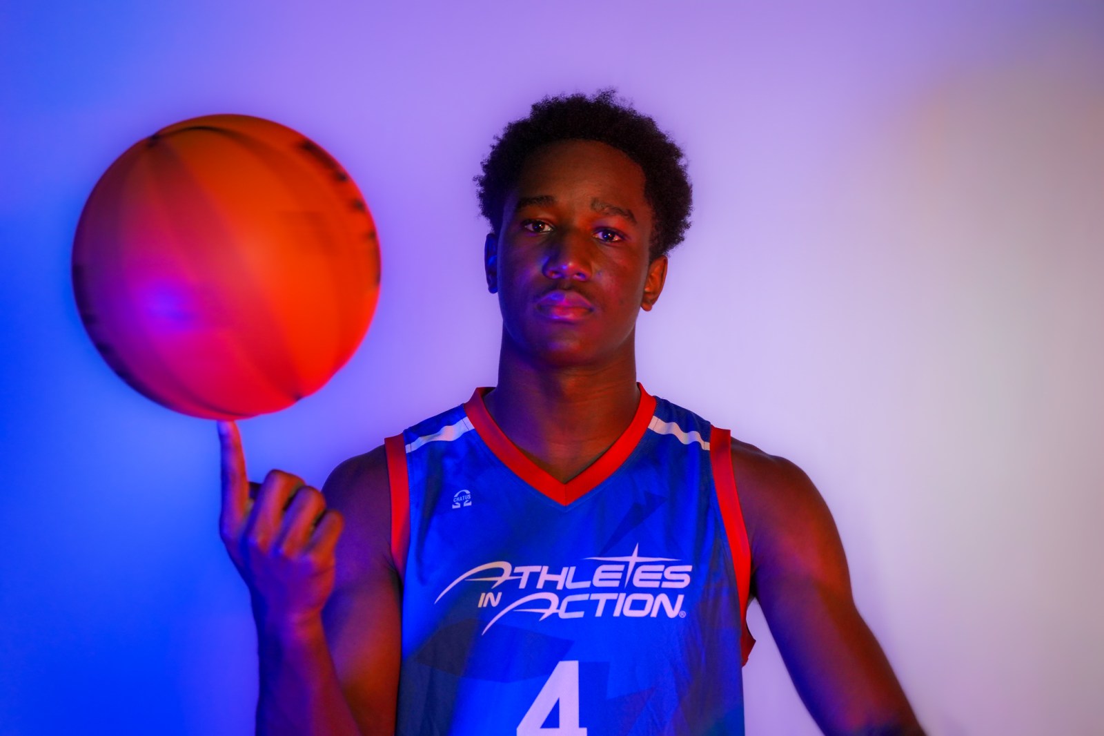 An AIA Prep basketball player spinning a ball