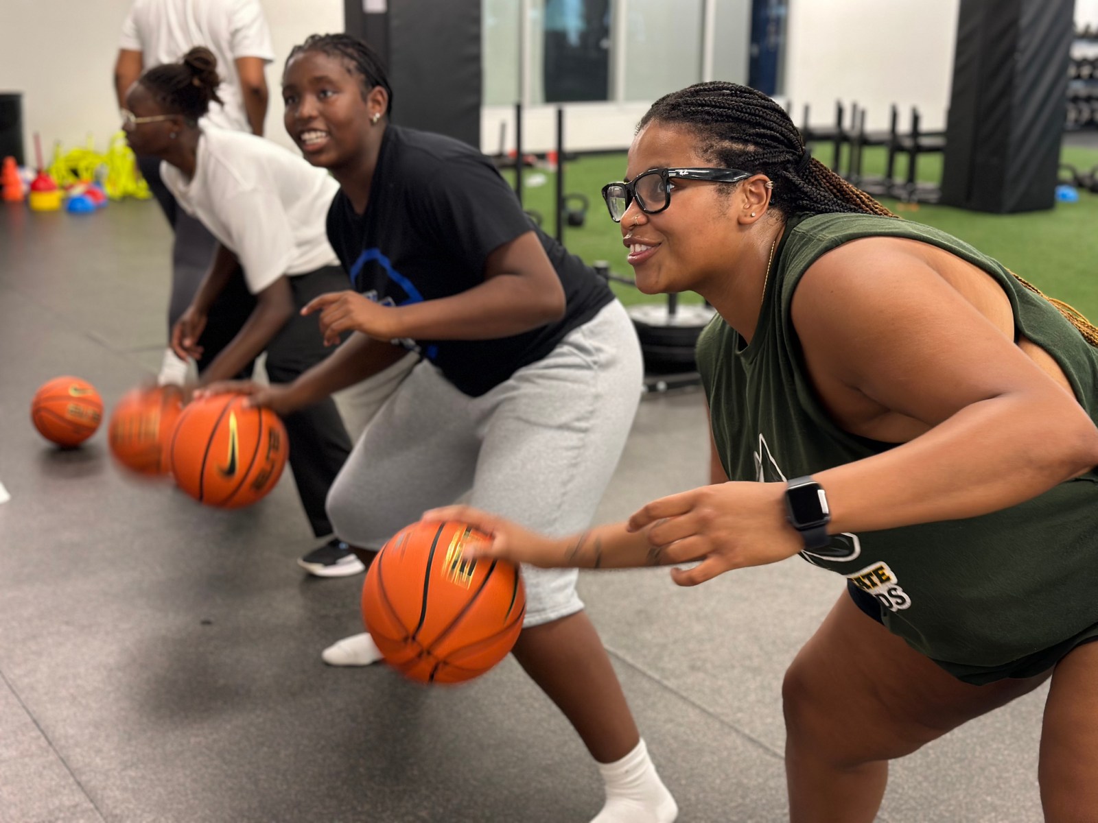 College women's basketball players running drills at an AIA team retreat