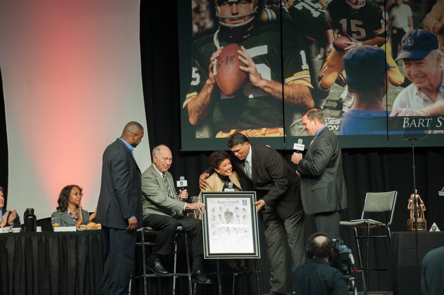 Award presentation at the 2012 Super Bowl Breakfast, its 25th year