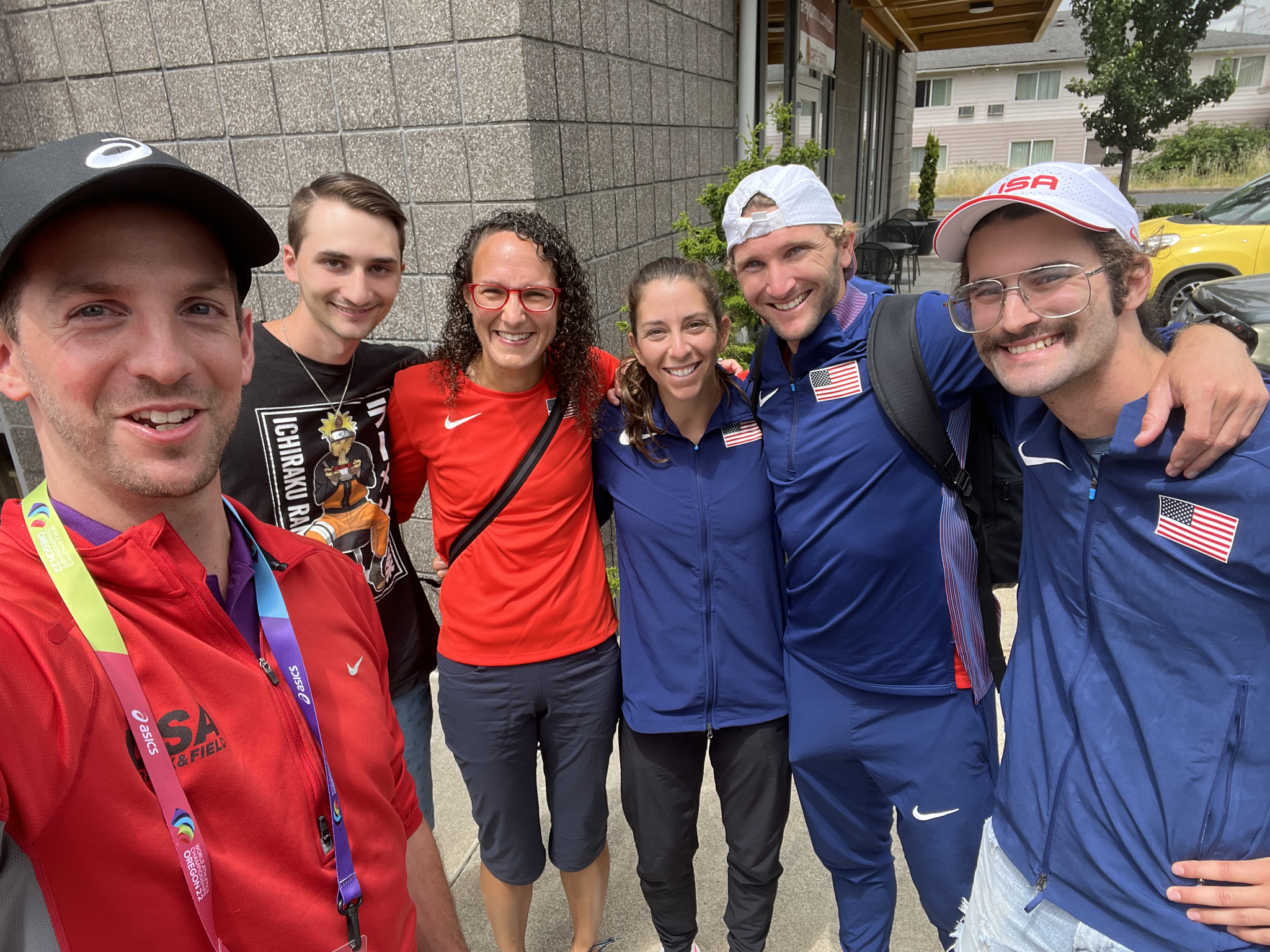 AIA staff with pro race walkers at the 2022 World Athletics Championships