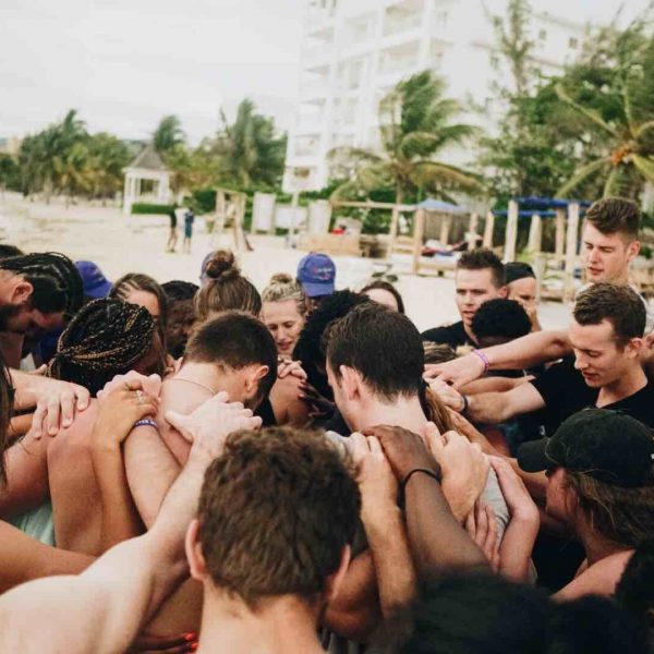 Group of athletes in prayer